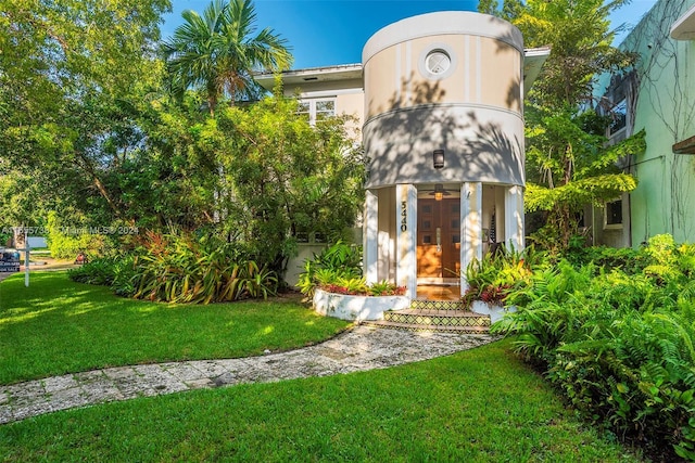 3440 N Meridian Ave, Miami Beach, FL 33140 - exterior space with stucco siding and a front yard