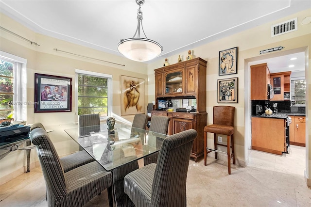 3440 N Meridian Ave, Miami Beach, FL 33140 - dining space with plenty of natural light, visible vents, and light tile patterned floors
