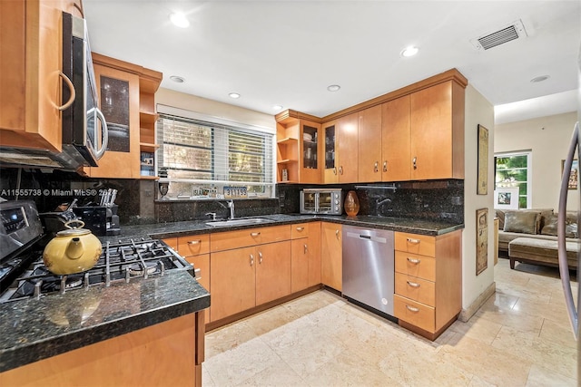 3440 N Meridian Ave, Miami Beach, FL 33140 - kitchen with visible vents, open shelves, glass insert cabinets, stainless steel appliances, and a sink
