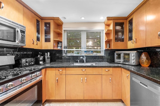 3440 N Meridian Ave, Miami Beach, FL 33140 - kitchen with open shelves, a toaster, appliances with stainless steel finishes, and a sink