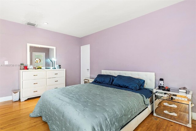 bedroom with light hardwood / wood-style floors