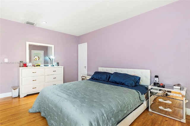 3440 N Meridian Ave, Miami Beach, FL 33140 - bedroom featuring baseboards and light wood finished floors