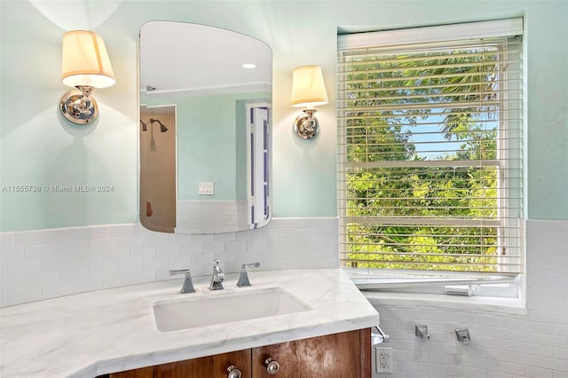 bathroom with plenty of natural light and vanity