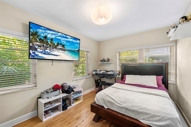 bedroom with light hardwood / wood-style flooring