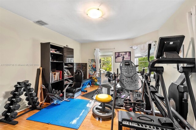 workout area featuring hardwood / wood-style floors