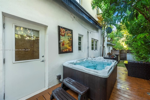 3440 N Meridian Ave, Miami Beach, FL 33140 - wooden deck featuring a hot tub and fence