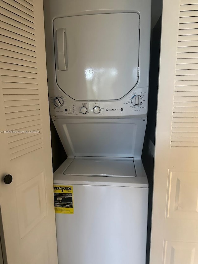 8592 W Sunrise Blvd Unit 214, Plantation, FL 33322 - laundry room with stacked washer / dryer