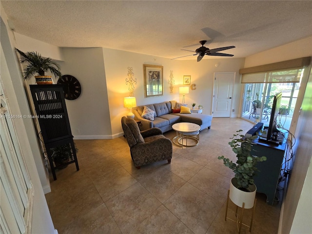 kitchen featuring tasteful backsplash, stainless steel appliances, ceiling fan, light stone counters, and light tile patterned flooring