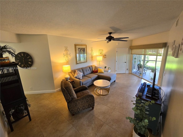 tiled living room featuring a textured ceiling and ceiling fan