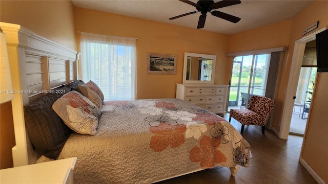 bedroom with multiple windows and ceiling fan