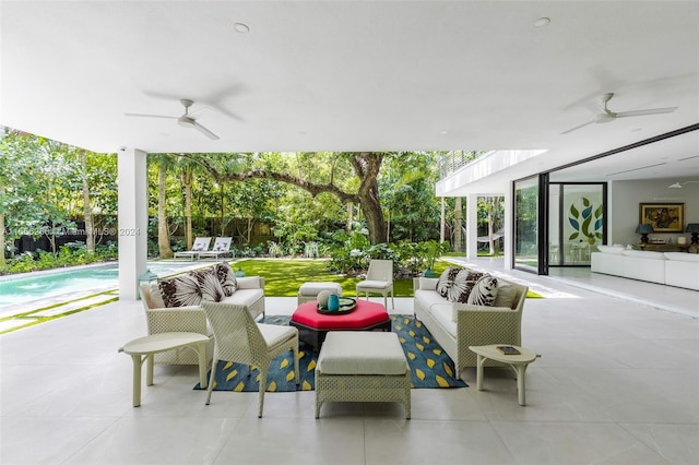 view of patio featuring ceiling fan and outdoor lounge area