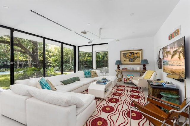 living room with floor to ceiling windows