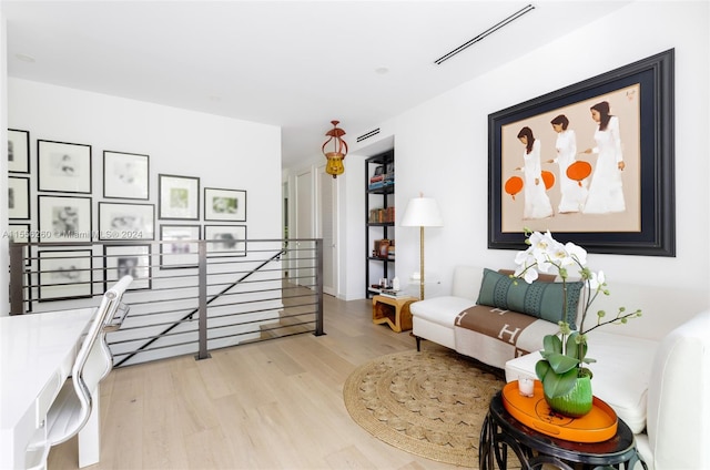 living area with light hardwood / wood-style floors