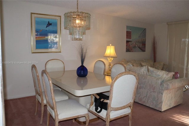 dining area with a notable chandelier and carpet floors