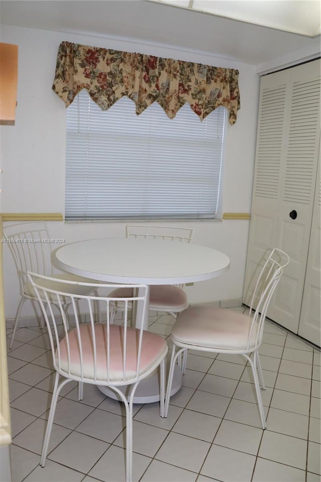 dining area with tile patterned flooring