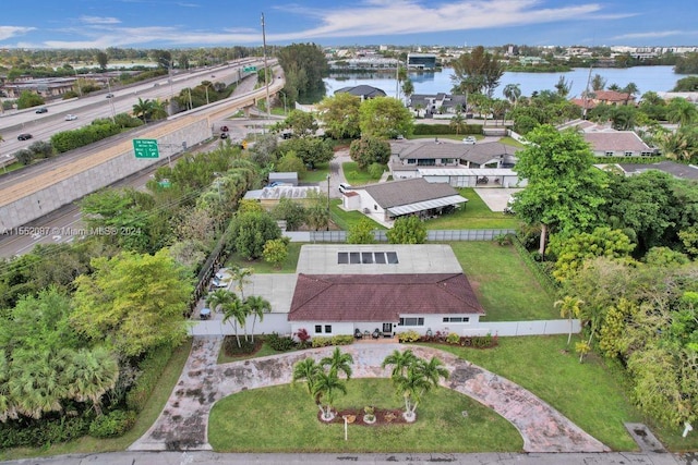 birds eye view of property featuring a water view