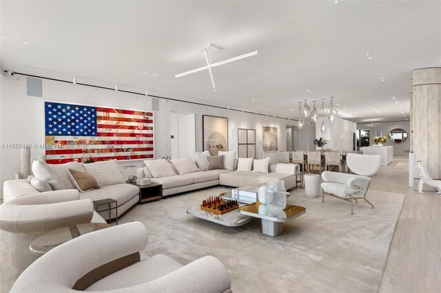 living room with carpet floors and expansive windows