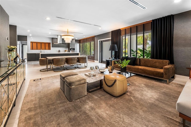 tiled living room featuring sink and plenty of natural light