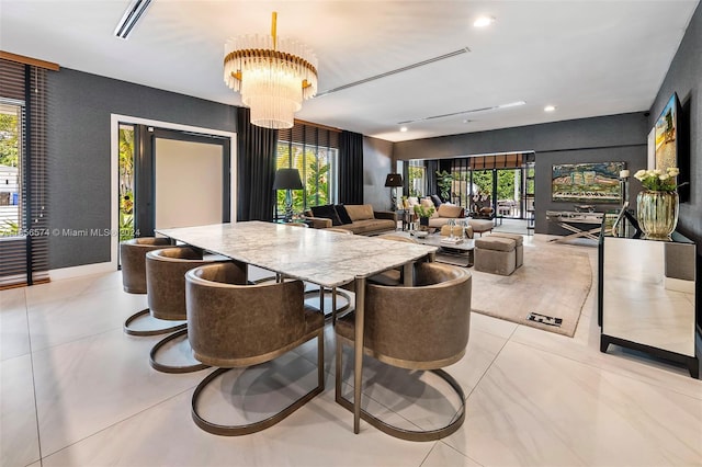 dining space with a notable chandelier