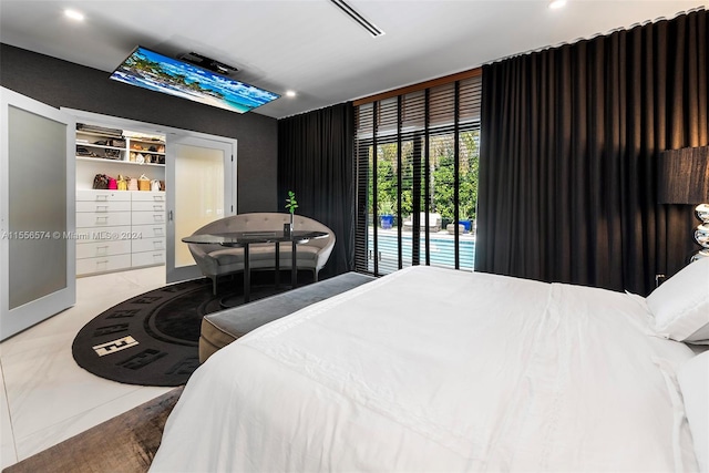 bedroom with light tile patterned floors