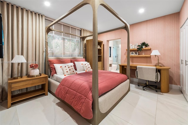 tiled bedroom featuring ensuite bathroom