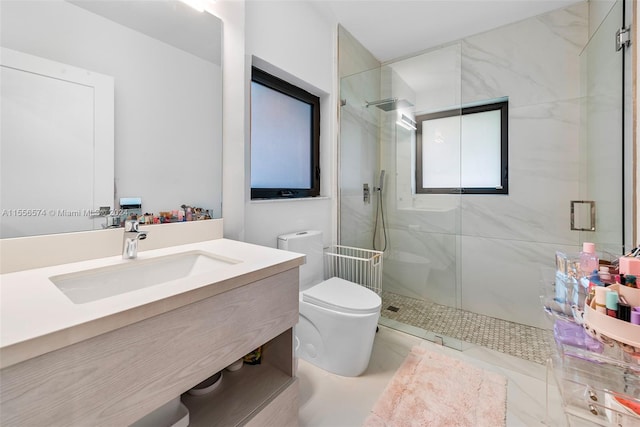 bathroom featuring vanity, toilet, and an enclosed shower