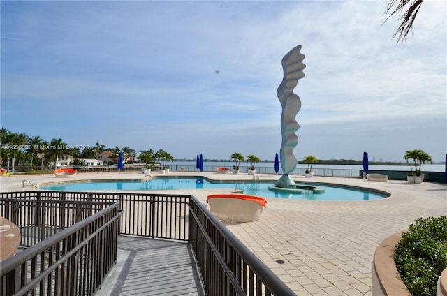 view of swimming pool with a patio area