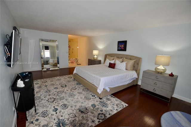 bedroom featuring dark hardwood / wood-style floors