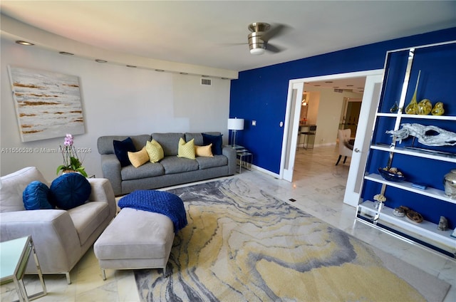 living room with ceiling fan and light tile floors