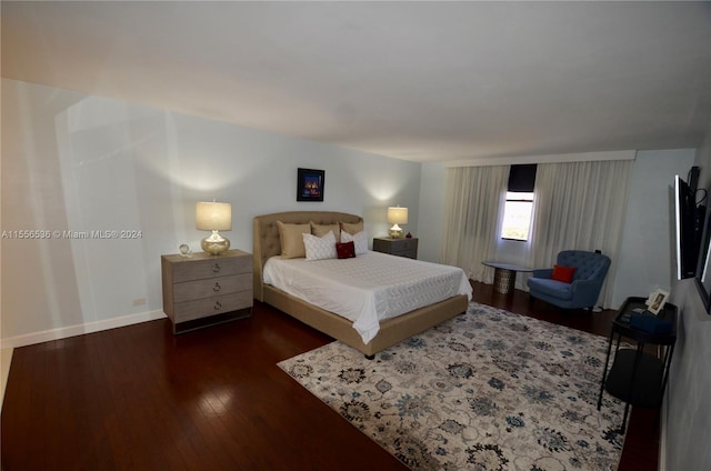 bedroom featuring dark wood-type flooring