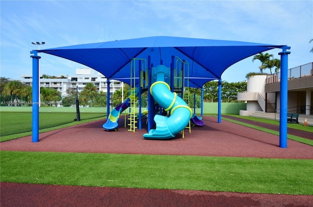 view of play area featuring a lawn