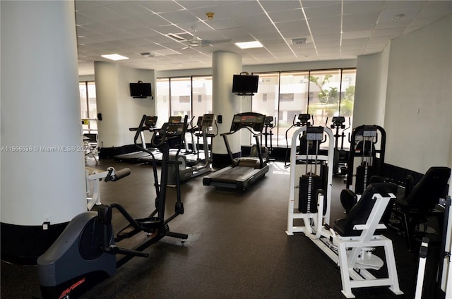 workout area featuring a paneled ceiling