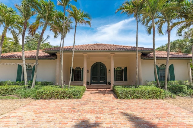 mediterranean / spanish-style home with a porch