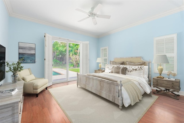 bedroom featuring ceiling fan, access to exterior, hardwood / wood-style floors, and crown molding