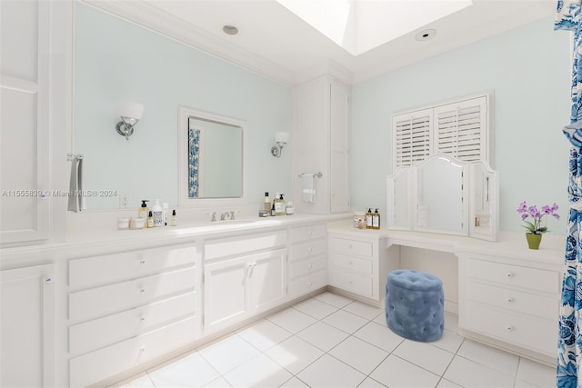 bathroom with crown molding, tile patterned flooring, vanity, and a skylight