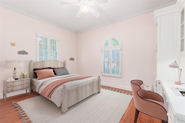 bedroom featuring ornamental molding, hardwood / wood-style floors, and ceiling fan