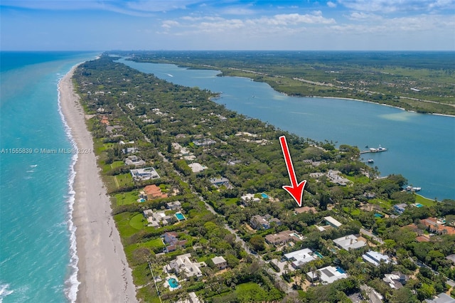 aerial view with a water view and a view of the beach