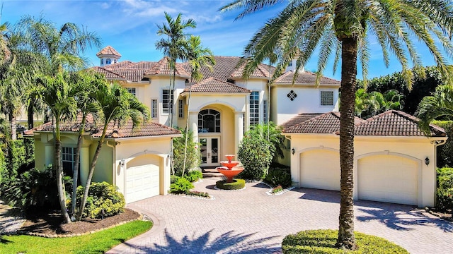 mediterranean / spanish-style house with french doors