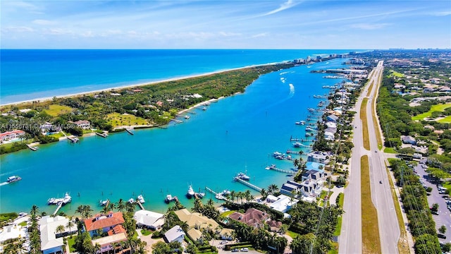 birds eye view of property featuring a water view