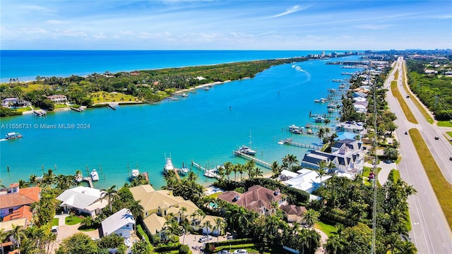 birds eye view of property featuring a water view