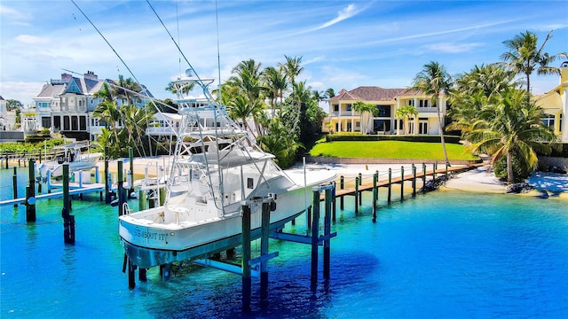 dock area featuring a yard and a water view