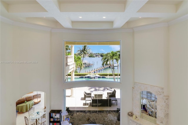 room details featuring a water view, coffered ceiling, and beamed ceiling