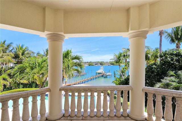 exterior space with a water view and a dock