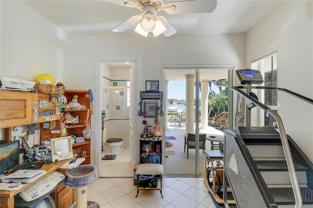 interior space with ceiling fan