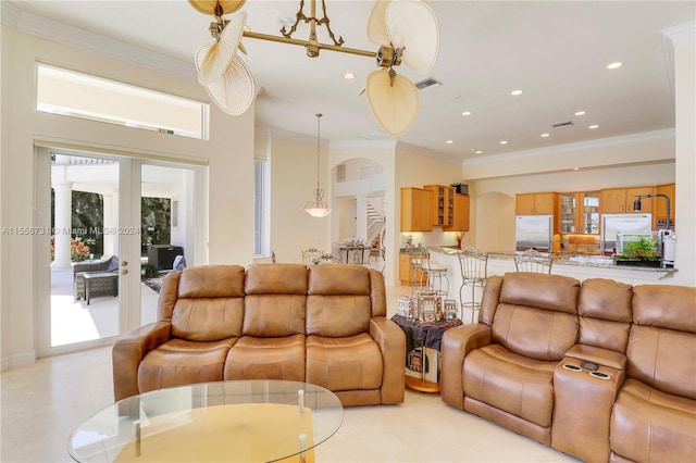 tiled living room with french doors and ornamental molding