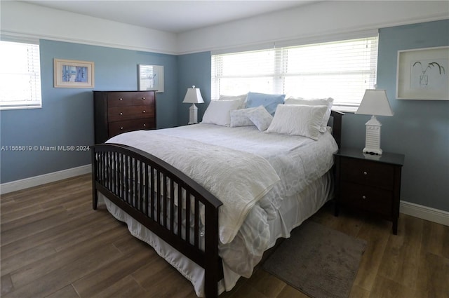 bedroom featuring dark wood-type flooring