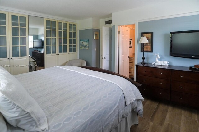 bedroom featuring dark hardwood / wood-style floors