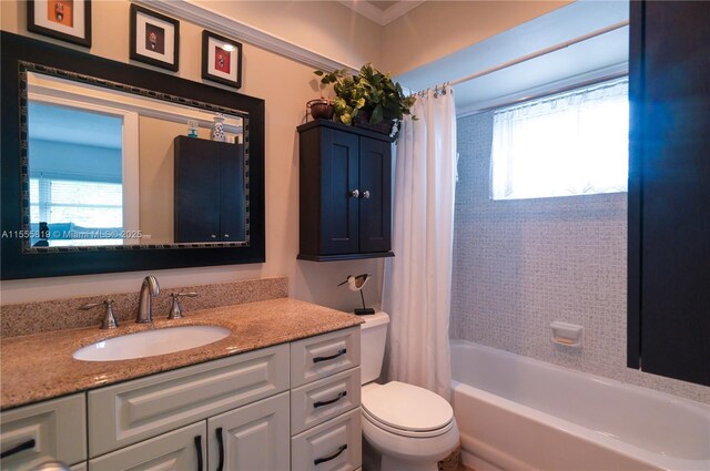 full bathroom featuring shower / tub combo, vanity, and toilet