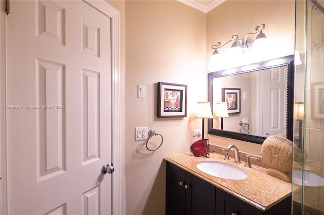 bathroom featuring vanity and ornamental molding