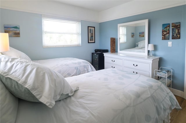 bedroom with hardwood / wood-style flooring